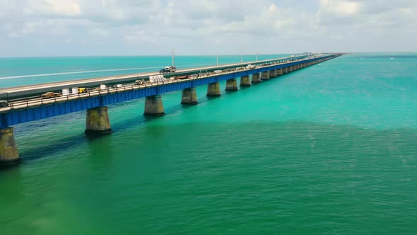 Old Bridge Running Over Ocean Surface Next to Operating One in Florida Keys USA