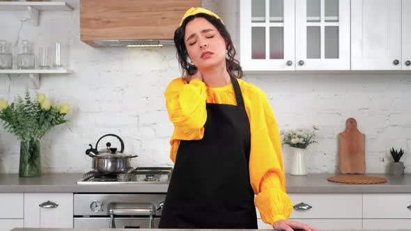 Portrait Tired Housewife in Home Kitchen Massages Neck After Intensive Cooking