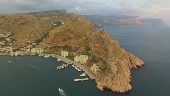 Drone View of Steep Cliffs and the Remains of a Ruined Fortress