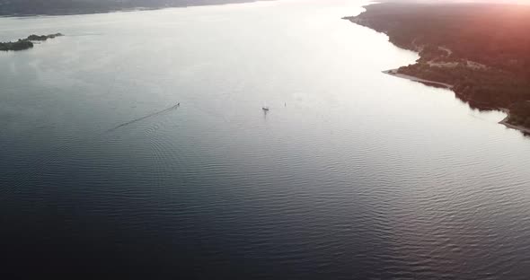 a married couple is sailing on a yacht on the river