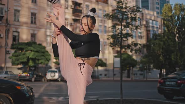 Young Woman Enjoys Dancing Contemporary Style at Back Sunset