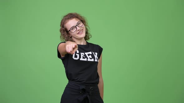 Young Happy Beautiful Nerd Woman Pointing To Camera