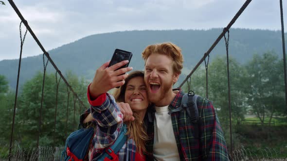 Tourists Travel Making Video in Mountains