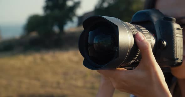 Content Creator Shoot Photography Closeup Outdoors Holding Camera in Hand