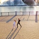 Happy teens dancing near river. Aerial view of carefree couple in love dancing near river - VideoHive Item for Sale