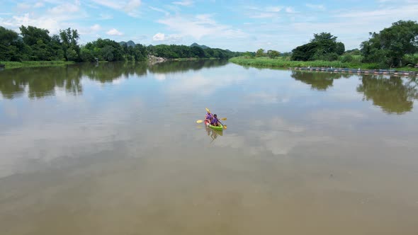 Couple Men and Women in Kayak on the River Kwai in Thailand