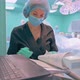 The Operating Nurse Monitors the Progress of the Operation - VideoHive Item for Sale