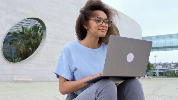 Clever African American Young Woman with Curly Hair Female Mixed Race Freelancer Student with