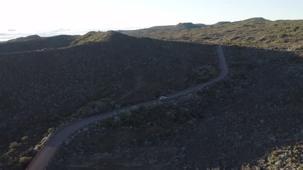 Aerial view of a car driving a serpentine road, Reunion.