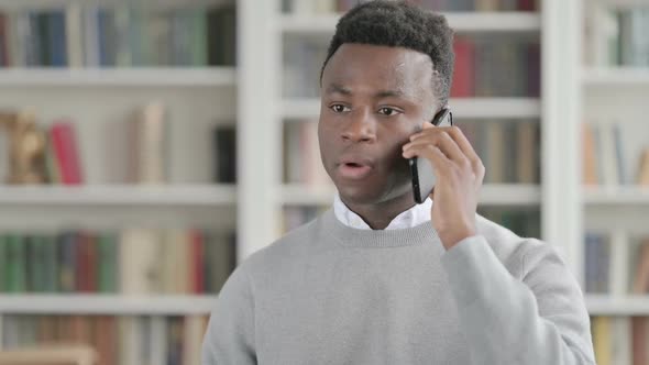 Portrait of African Man Talking on Smartphone