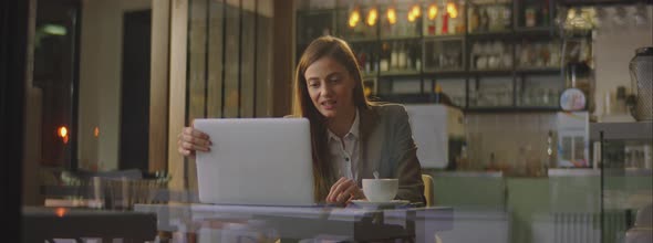 Smiling woman communicating online