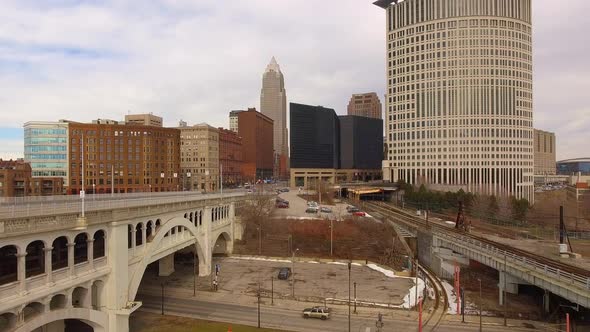 Rising drone shot of downtown Cleveland Ohio with traffic heading into the city