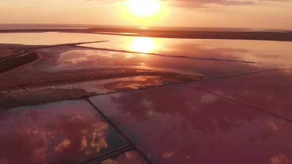 Aerial Drone View To Salt Mineral Lake with Pink Water and Coastline