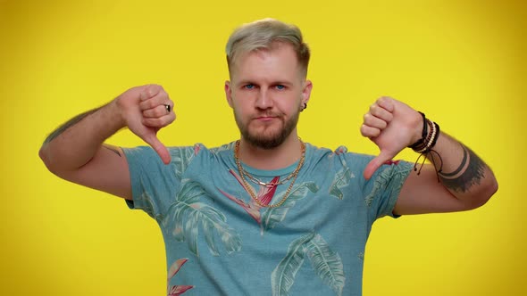 Upset Man in Fashionable Tshirt Showing Thumbs Down Sign Gesture Disapproval Dissatisfied Dislike