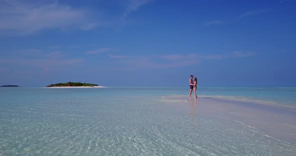 Romantic lady and man after marriage in love spend quality time on beach on sunny white sandy 4K bac