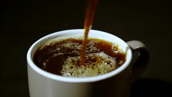 Coffee being poured into a coffee cup, Ultra Slow Motion