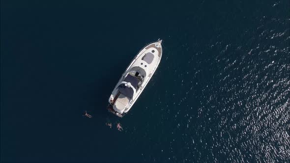 Luxury Yacht on Sea with swimming people around..!