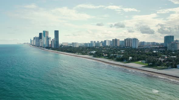  Aerial View of Clean and Warm Teal Waters of Atlantic Ocean. Front Line Buildings