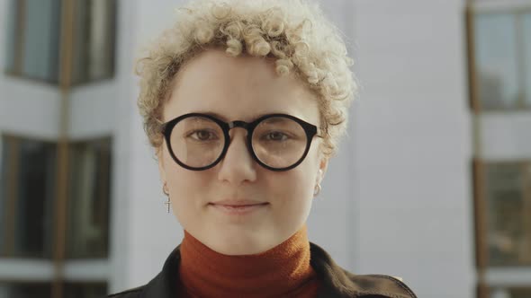 Portrait of Young Girl in Glasses Outdoors