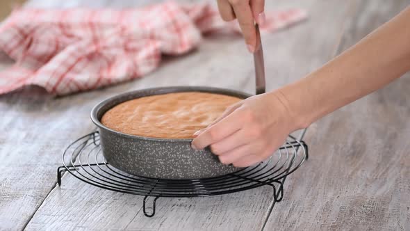 Confectioner Taking Out of Cake From Cake Mold.