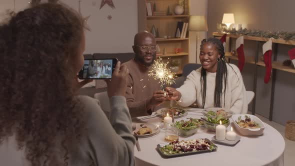 Girl Filming Parents at Christmas