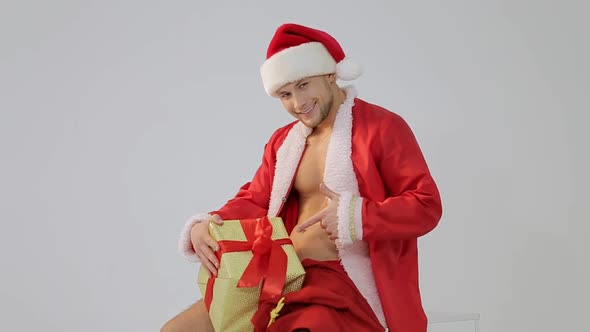 Sexy Santa Claus, Sexy Man Macho With A Sexy Muscular Athletic.