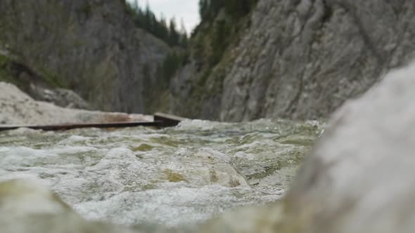 Slow Motion View of a Creek with Water Running over Rocks- Truck Shot