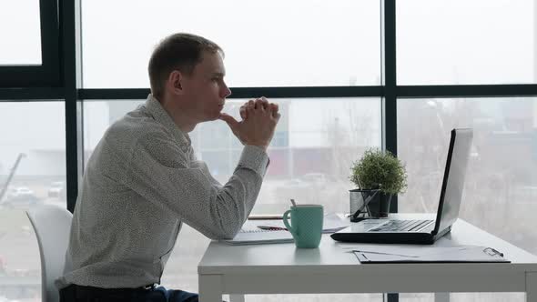 Tired Caucasian Male Working in the Office