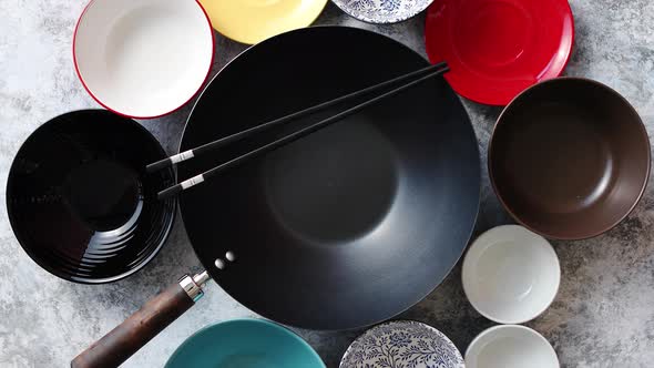 Traditional Empty Black Iron Wok Pan Placed on Stone Background