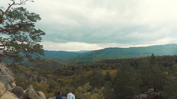 Friends Talk on Mountain Top