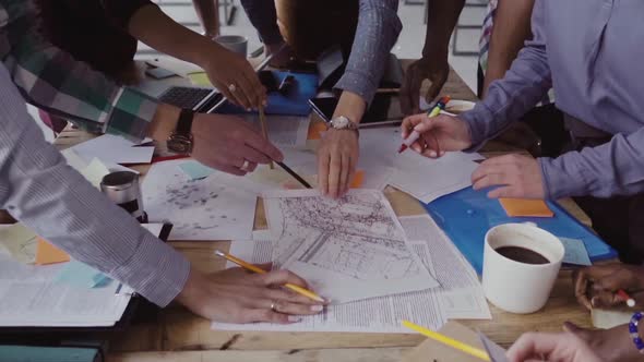 Close-up View of Young Business Team Working Together Near the Table, Brainstorming.