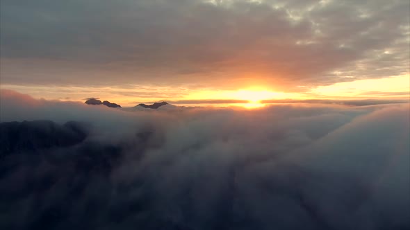 Midnight sun above the clouds on Lofoten in Norway