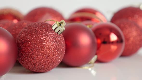 Shallow DOF Christmas bauble with sequins close-up 4K tilting video