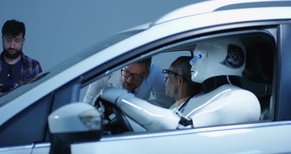 Scientist Testing Car Driving Robot