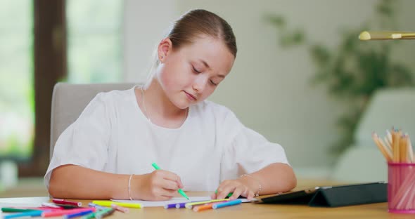 Closeup Focused Smiling Teen Girl at the Desk Draws with Green Felttip Pens on White Paper Sheet and