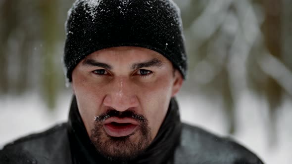 Portrait of Aggressive Man After Training or Run in Winter Forest Middleaged Person with Black Beard