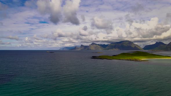 AERIAL: Crystal clear artic ocean on a beautiful summer day. Amazing Lofoten