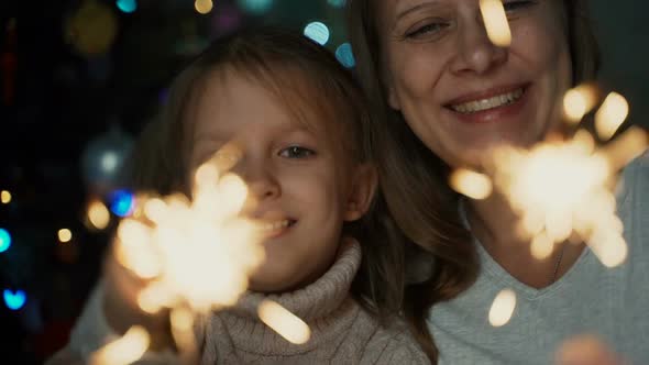 Little Girl Child Together With Mother Light Bengal Lights