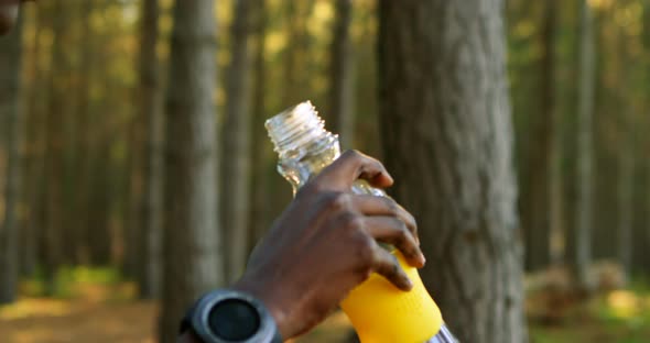 Female Jogger Drinking Water in The Forest 4k