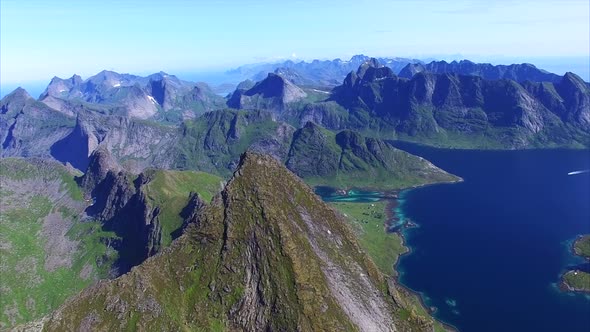 Fast flight over peak on Lofoten islands in Norway