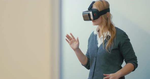 Woman entertaining with VR-headset for mobiles