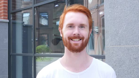 Smiling Young Man Outside His Office, Red Hairs