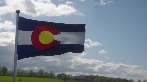 Flag of Colorado State Region of the United States Waving at Wind