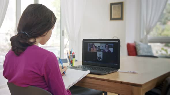 Teenage girl attending an online lesson during the COVID-19 lockdown