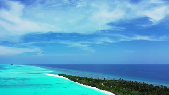 Aerial texture of perfect lagoon beach voyage by shallow ocean with white sandy background of a picn