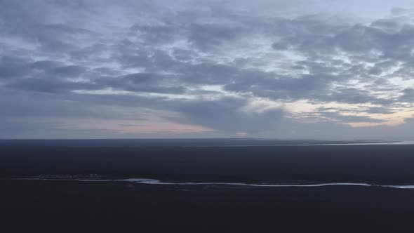 Dramatic Drone View of Vast Horizon and a Small Body of Water