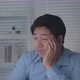 Tired Asian Male Worker Working on desktop computer in the Corporate Office, Work until night - VideoHive Item for Sale
