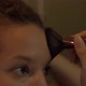 Serious Young Woman Brunette Applies Makeup at Home Macro - VideoHive Item for Sale