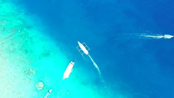 Aerial top view texture of tranquil coast beach adventure by blue sea with white sand background of 