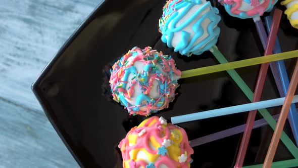 Decorated Ballshaped Sweets on Sticks